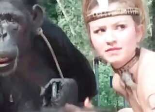 Filthy whore is doing her best to seduce a monkey for sex