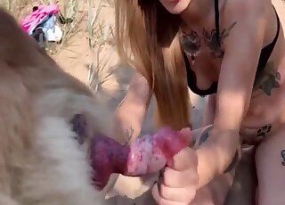 Skinny blonde is set to try dog porn by the beach while being filmed